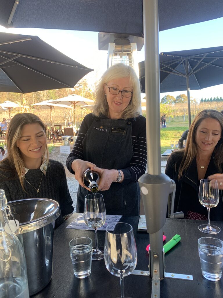 Guests sampling local wines during a Southern Highlands wine tour with Vino Rosso Tours.